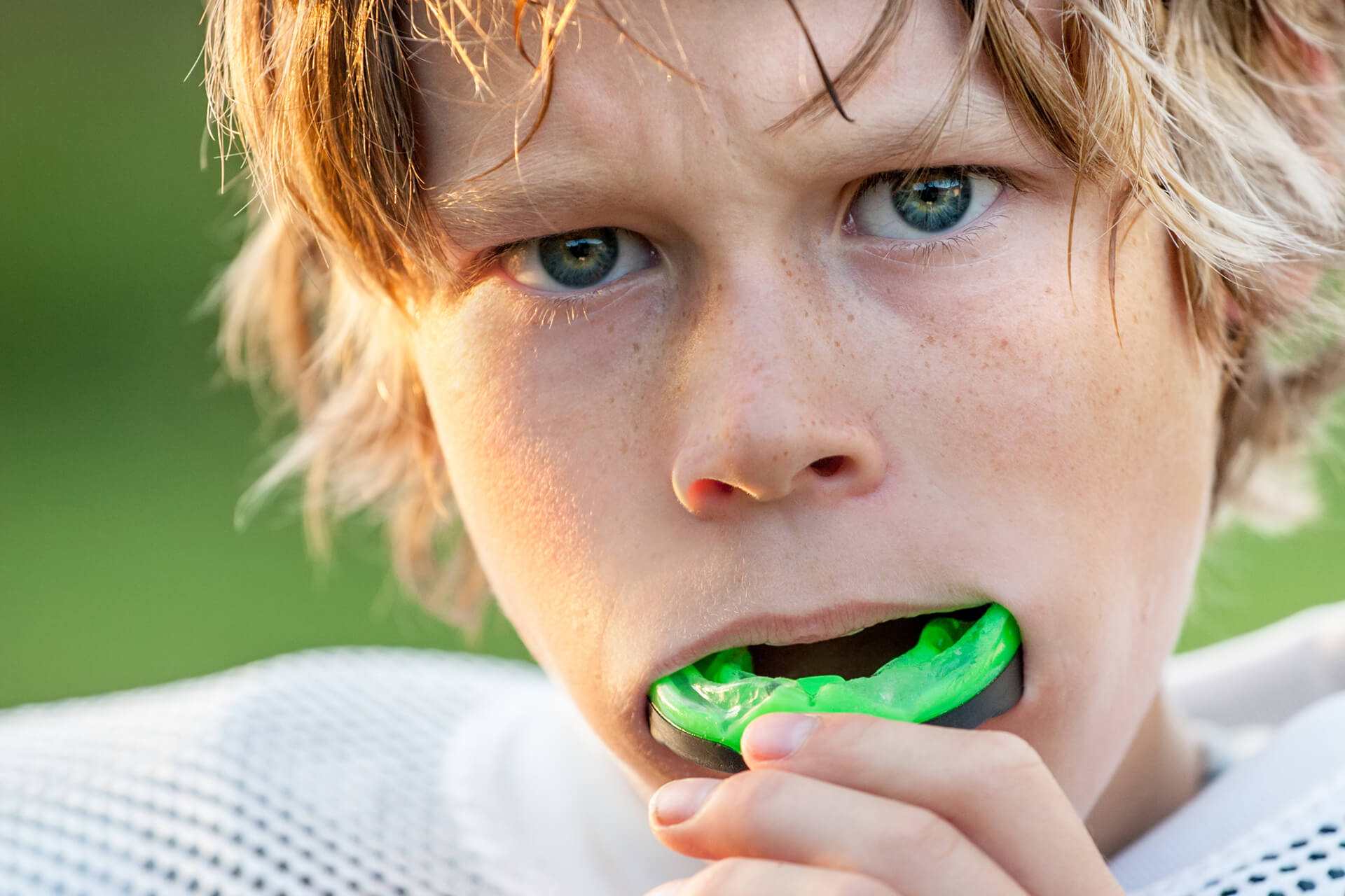 boy putting sports guard in